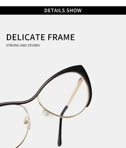 Dettaglio della montatura di occhiali cat-eye in metallo nero e oro