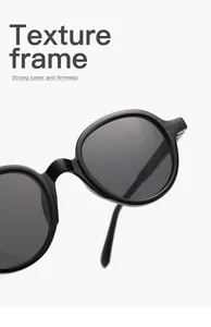 Close-up detail of black round frame sunglasses showing the high luster frame texture