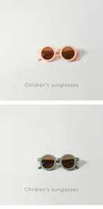 Round children's sunglasses in peach and sage green colors with UV protection lenses
