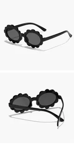 Multiple angles of cute black flower-shaped children's sunglasses with oval lenses