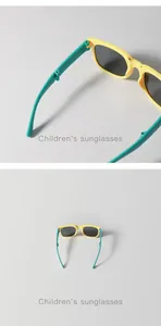 Detailed view of foldable children's sunglasses with yellow frames and teal temples.