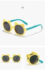 Cute yellow bear-ear children's sunglasses with teal arms and foldable design details