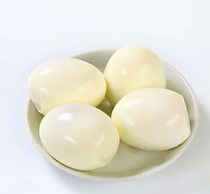 Peeled hard-boiled eggs in a white bowl showing effective result of manual egg peeler tool
