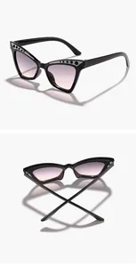 Macro view of black children's cat-eye sunglasses with sparkling rhinestone accents