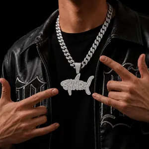 Close-up of hip-hop shark pendant with iced-out rhinestones on a cuban chain.