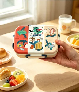 Detailed view of children's cartoon bento box with puzzle-shaped lid and dinosaur print