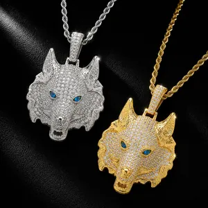 Close-up of hip hop wolf head pendants with iced out zircons in gold and silver