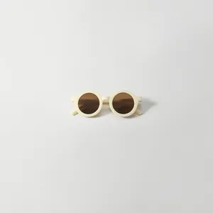 Minimalist vintage round frame children's sunglasses in cream white with brown UV lenses