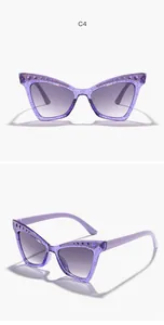 Close-up of purple glitter cat-eye sunglasses with rhinestone detailing for kids