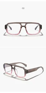 Detail view of double-bridge eyeglasses frame with a stylish grey to pink gradient finish