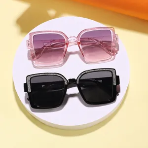 Trendy square kids sunglasses featuring stylish glitter frames and protective gradient lenses