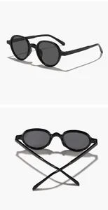 Detail view showing front and top perspectives of black round frame sunglasses