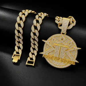 Iced out gold plated Cuban chain necklace with King of Kings round rhinestone pendant