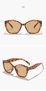 Detailweergave van cat-eye zonnebril met schildpadmotief en bruine UV-glazen.