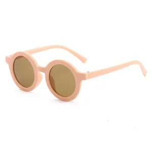 Trendy round-frame children's sunglasses in peach pink finish for toddler eye protection