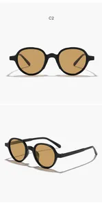 Detailed front and side views of stylish round black sunglasses with amber lenses.