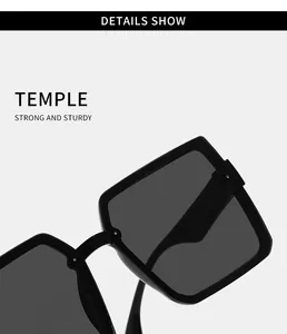 Detailed macro view showing the sturdy temple and hinge of black oversized square sunglasses.