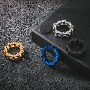 Hip hop style titanium steel bike chain rings in gold, silver, blue, and black finishes.