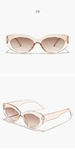 Visuali dettagliate degli occhiali da sole cat-eye champagne con lenti sfumate di classe