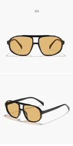 Side view detail of retro oversized double-bridge aviator sunglasses with yellow lenses.