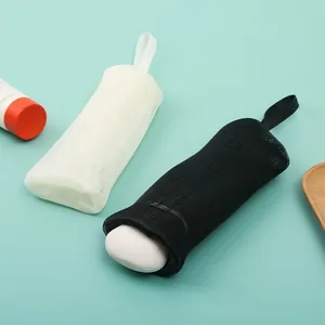 Set of black and white multi-layer foaming mesh soap bags with hanging loops for bathroom use