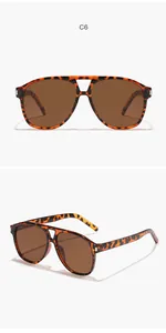 Vista dettagliata di occhiali da sole aviator retrò unisex con montatura tartarugata