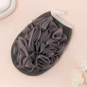 Close-up view of a gray 2-in-1 exfoliating loofah bath glove with soft skin-friendly texture