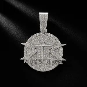 Detailed macro view of iced out silver King of Kings pendant with cubic zirconia