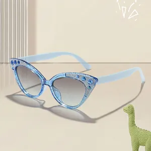 Cute blue cat-eye sunglasses for kids featuring fine glitter and sparkling blue rhinestones
