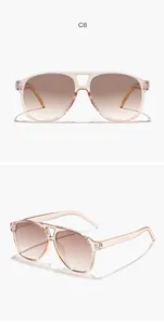Vista dettagliata degli occhiali da sole aviator vintage rosa chiaro con lenti marroni