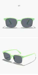 Macro detail view of mint green half-frame square sunglasses for kids in grey lens