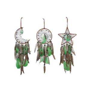 Set of three handmade dreamcatchers with green feathers in moon, sun, and star shapes.
