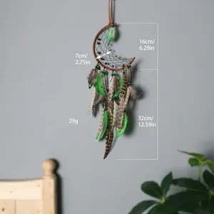 Handmade bohemian moon dreamcatcher with green feathers and beads showing precise dimensions