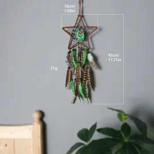 Handmade bohemian star-shaped dream catcher with green feathers for room wall decor