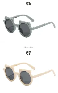 Side view of cute foldable bear-shaped sunglasses for children in mint and beige colors.