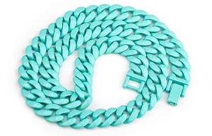 Close-up detail of a chunky turquoise stainless steel Cuban link necklace for fashion