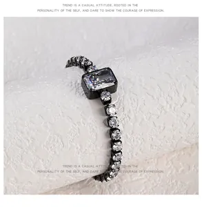 Detailed close-up of elegant black plated bracelet with sparkling crushed ice zircons.