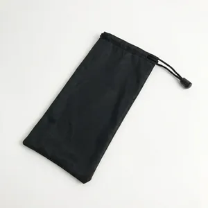 Close-up of black microfiber drawstring pouch for glasses and accessories