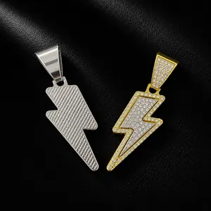 Detailed view of hip-hop lightning pendants in silver and iced-out gold finishes.