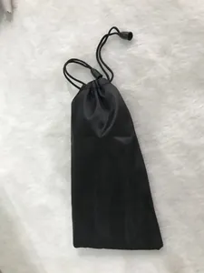 Detailed macro view of black microfiber drawstring pouch for sunglasses and jewelry