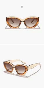Lunettes de soleil œil de chat léopard avec monture ambre et verres dégradés bruns