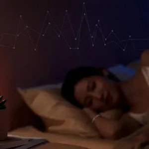 Close-up detail of an Asian woman sleeping while wearing a negative ion volcanic stone bracelet