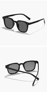 Vue détaillée de lunettes de soleil carrées noires avec d'élégants clous de riz décoratifs.