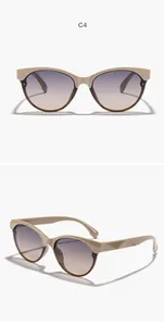 Vista dettagliata di eleganti occhiali da sole beige cat eye con lenti viola sfumate