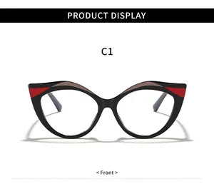 Vista frontale di occhiali cat-eye vintage con montatura nera e rossa di tendenza
