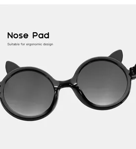 Close-up detail of ergonomic nose pads on cat-ear round frame sunglasses