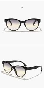Eleganti occhiali da sole cat-eye neri con lenti PC sfumate viola e gialle di moda