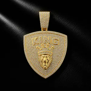 Close-up of hip-hop lion head shield pendant with KING crown and cubic zirconia