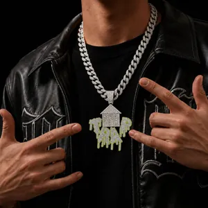 Close-up of hip hop trap house pendant with iced out rhinestones and green drip