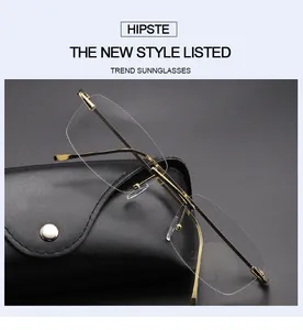 Detail view of vintage rimless square sunglasses with gold metal frame and leather case